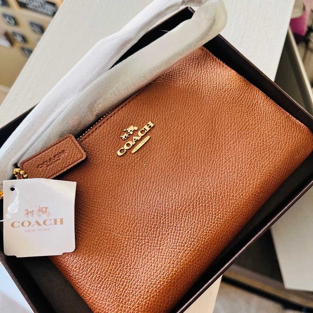 Coach wristlet (saddle color)